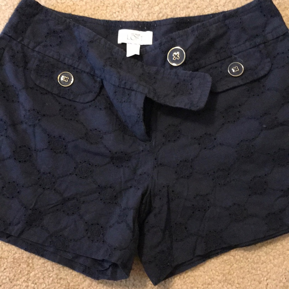 Navy shorts with gold buttons